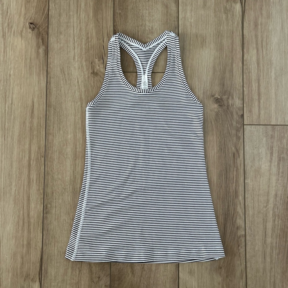 Lulemon sleeveless top or yoga top.  Strip.  Like new condition. Size 4.